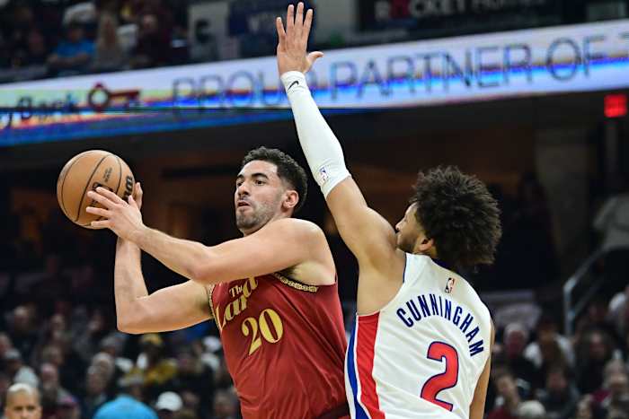 Nov 17, 2023; Cleveland, Ohio, USA; Cleveland Cavaliers forward Georges Niang (20) looks to pass as Detroit Pistons guard Cade Cunningham (2) defends during the first half at Rocket Mortgage FieldHouse.